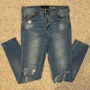Medium wash skinny jeans with rips